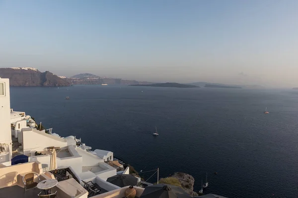 View to oia, santorini, greece at sunset. — Stock Photo, Image