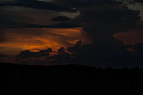 Extremely black sky with sunset. Typical African sky. Namibia. Africa.