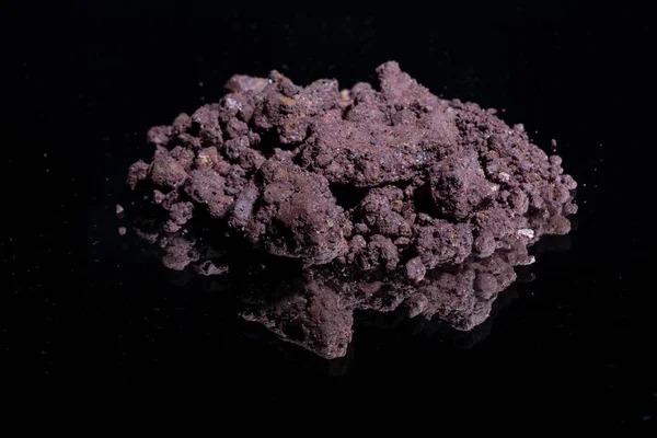Ore from a diamond mine. isolated on black background with reflexion. — Stock Photo, Image