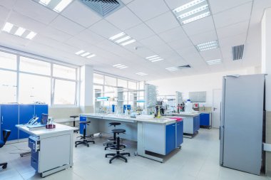 Scientific laboratory room with microscopes.