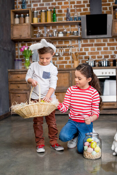 Kids holding easter eggs