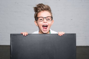 Boy holding blackboard  clipart