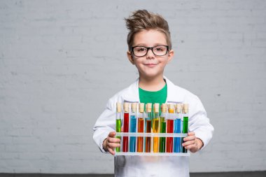 Little boy with test tubes clipart