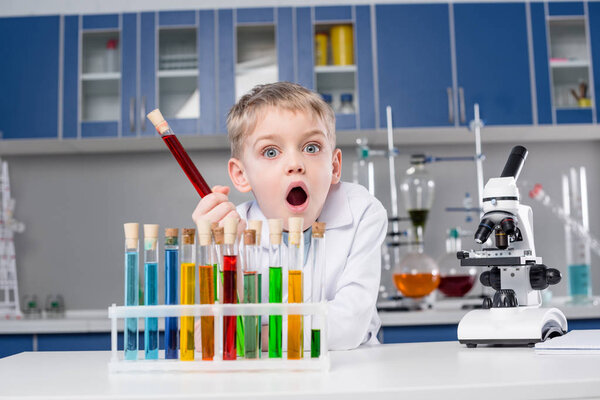 Little boy in chemical laboratory