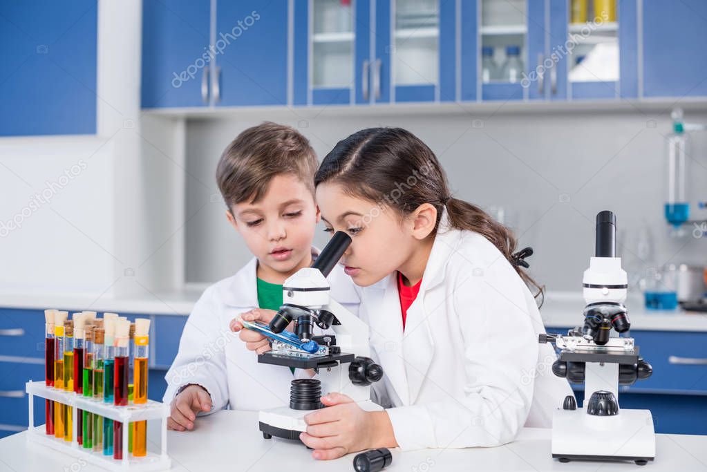 Kids using microscope