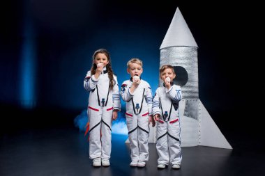 Kids in astronaut costumes  clipart