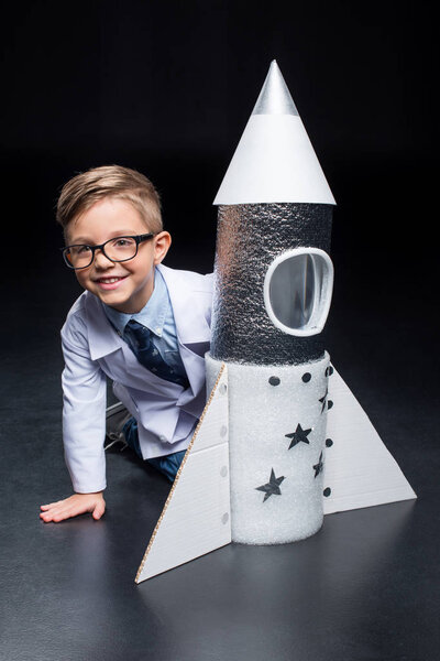 Little boy with rocket