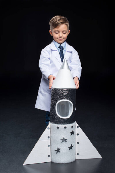 Little boy with rocket