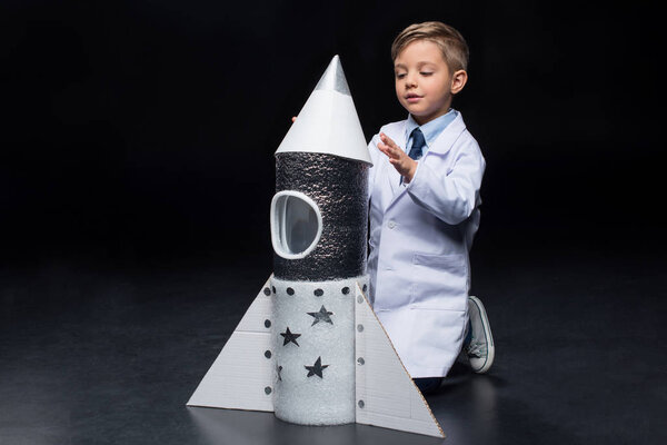 Little boy with rocket