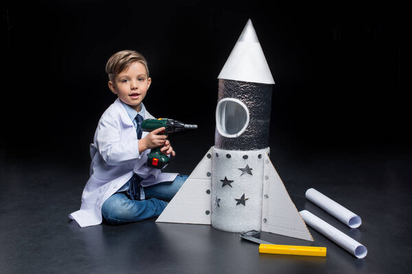 Little boy with rocket