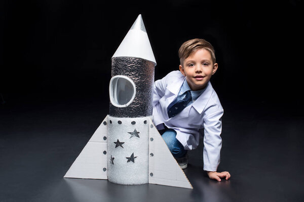 Little boy with rocket