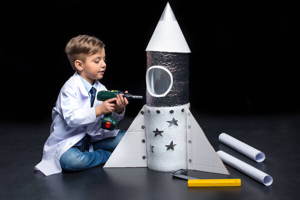 Little boy with rocket