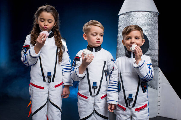 Kids in astronaut costumes 
