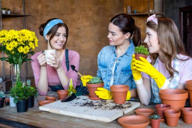 women planting flowers clipart