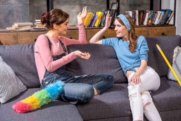 Young women with cleaning tools — Stock Photo, Image