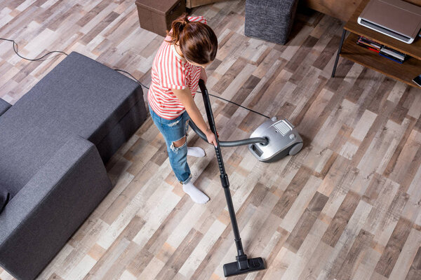 Woman with vacuum cleaner