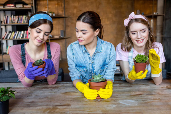 women with plants in flowerpots