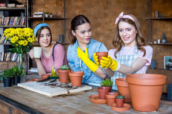 women planting flowers