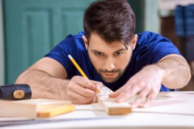 carpenter working with wooden plank clipart