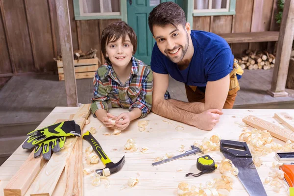 Father and son in workshop — Stock Photo, Image