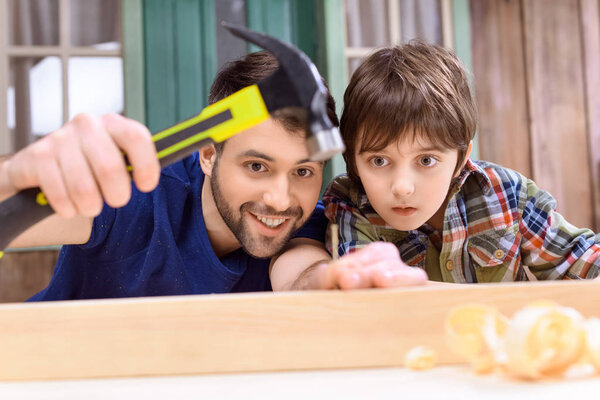 Father and son in workshop