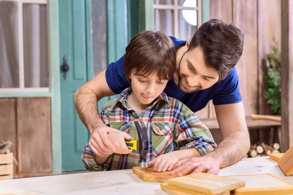 father and son in workshop