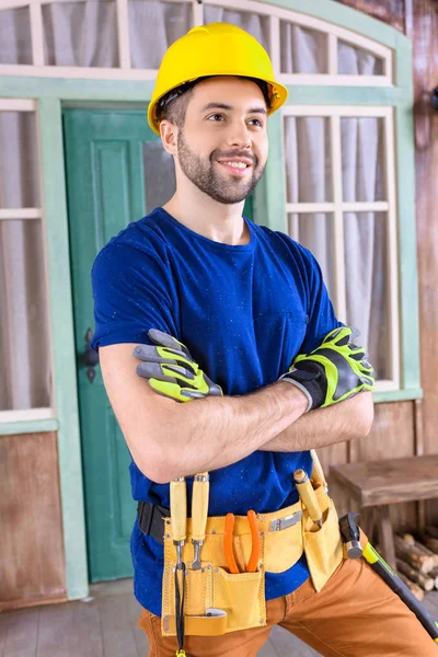 Carpenter with tools on porch — Stock Photo, Image