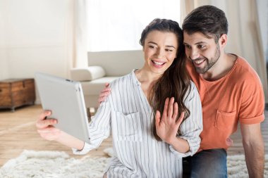 Couple with digital tablet clipart