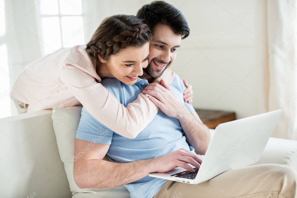 couple using laptop