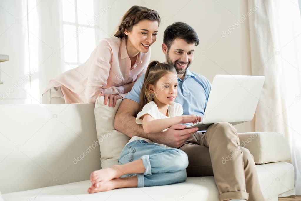 family using laptop