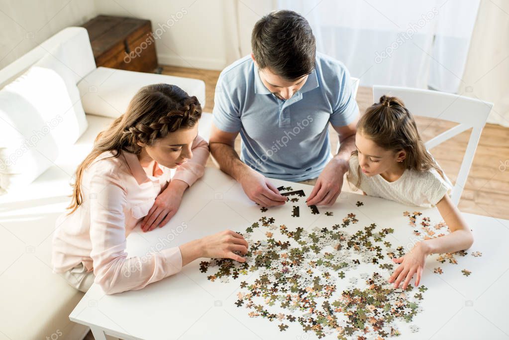 family playing with puzzles