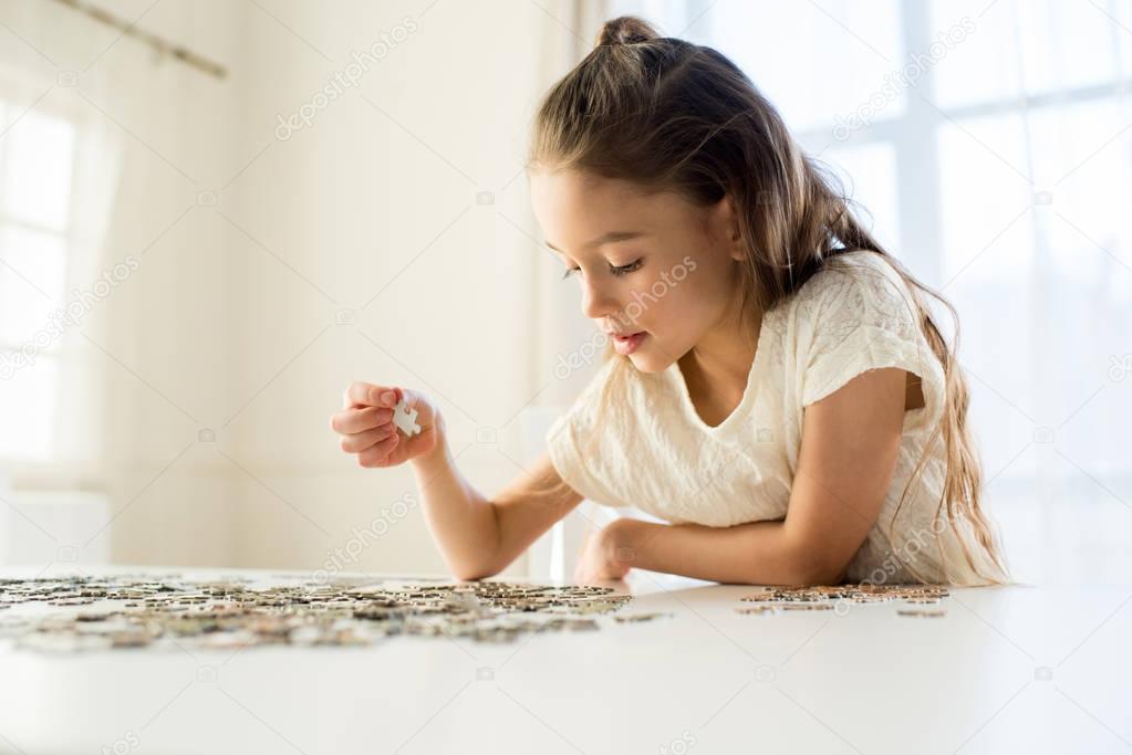 girl playing with puzzles