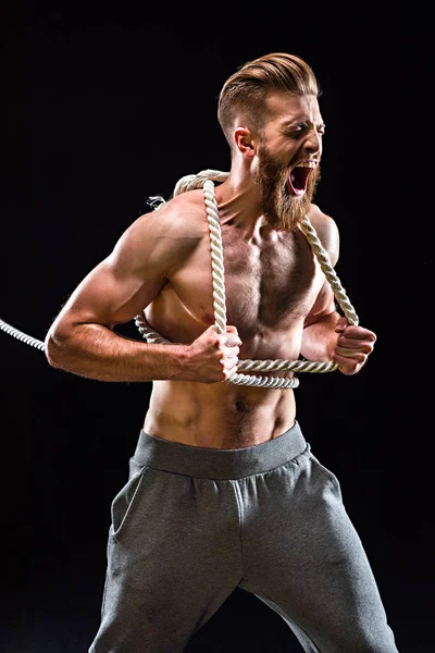 Sportsman pulling rope — Stock Photo, Image