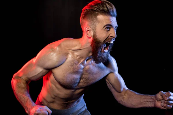Knappe bodybuilder schreeuwen — Stockfoto