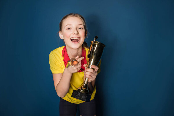 girl with medals and trophy 