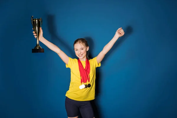 Girl with medals and trophy — Stock Photo, Image