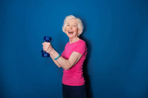 Senior woman with dumbbells — Stock Photo, Image