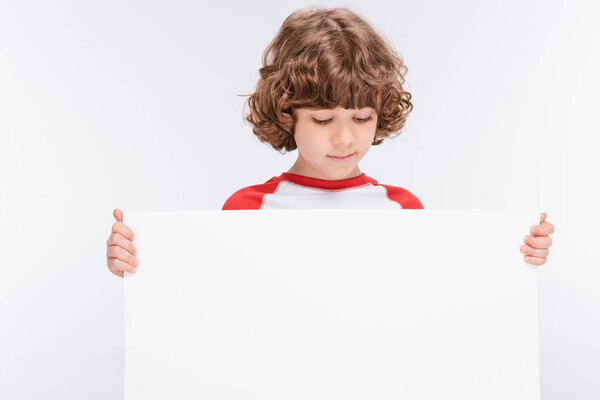 Boy holding white blank board