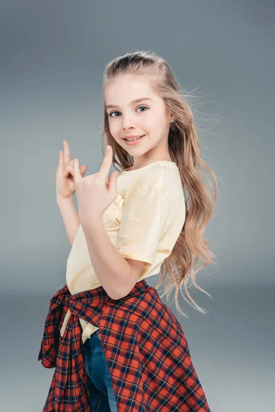 Girl gesturing rock sign — Zdjęcie stockowe