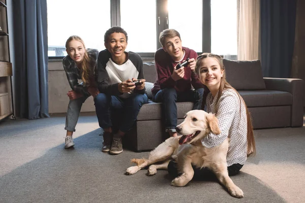 Multicultural teenagers with joysticks — Stock Photo, Image