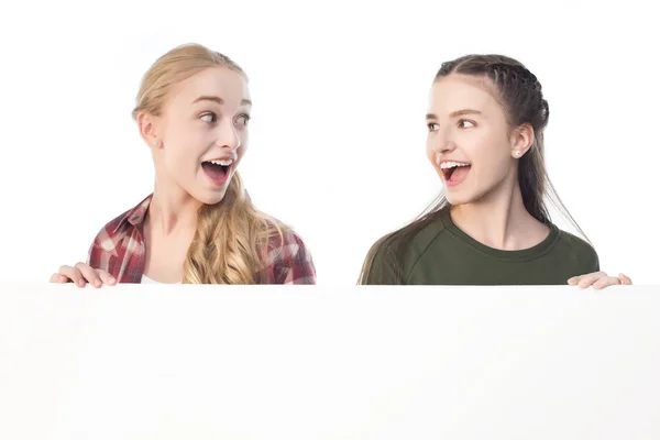 Teenage girls with banner — Stock Photo, Image