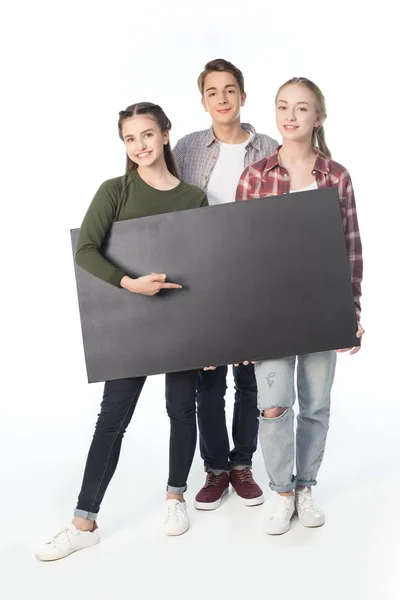 Teenagers with big banner — Stock Photo, Image