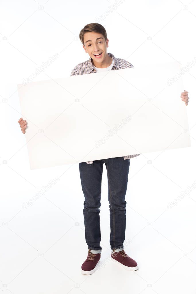 teenage boy holding banner