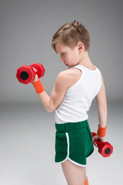 Active boy with dumbbells — Stock Photo, Image