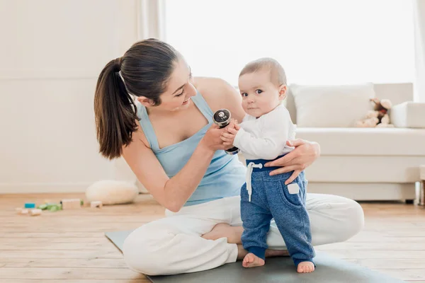 Woman with baby child playing together — Stock Photo, Image