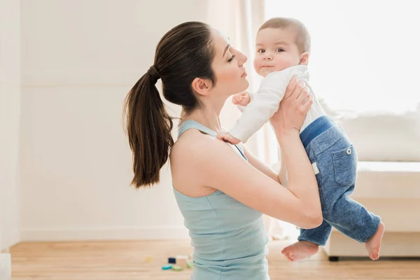 Young mother playing with her son — Stock Photo, Image