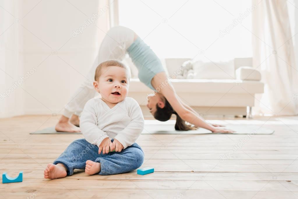 Young woman in downward dog position