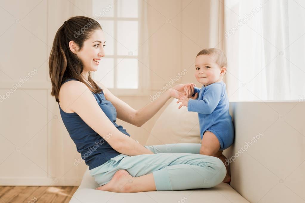 Mother with baby boy at home