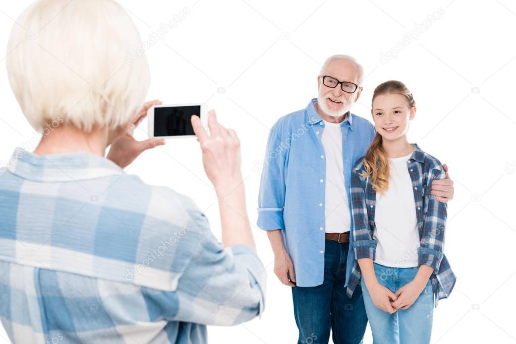 Grandmother taking photo on smartphone