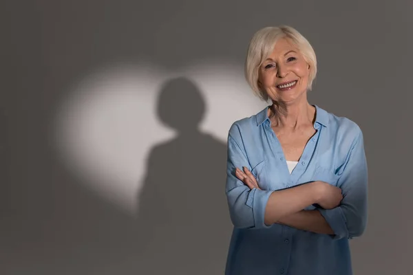 Woman with heart shaped shadow — Stock Photo, Image